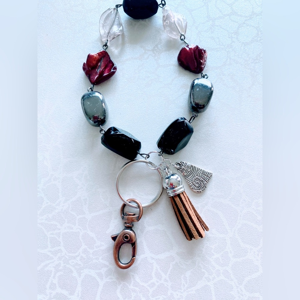 Red and Black Beaded Bracelet with Charms